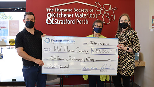PEER Group presenting donation cheque to KW Humane Society