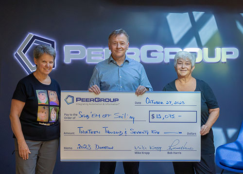 PEER Group presents donation cheque to Send'Em Off Smiling