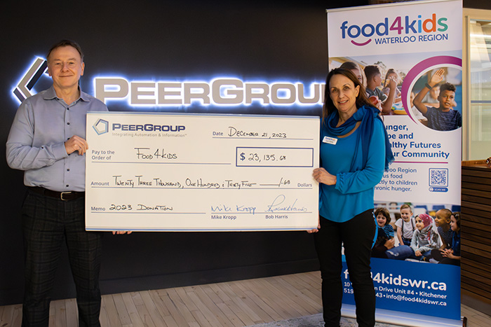 PEER Group CEO presents donation cheque to Food4Kids