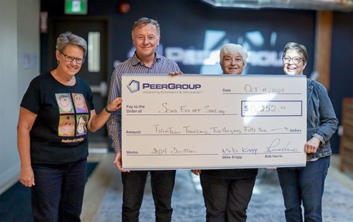 PEER Group CEO presents donation cheque to Send'Em Off Smiling