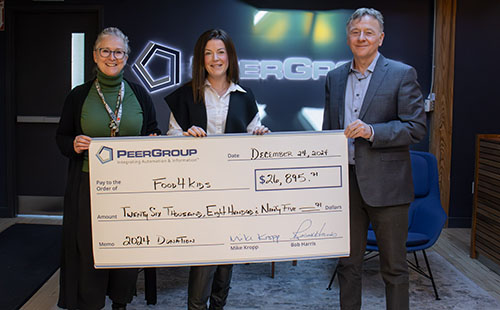 PEER Group presents donation cheque to Food4Kids