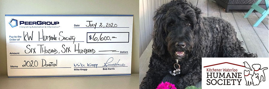 Photo of cheque to KW Humane Society beside a dog