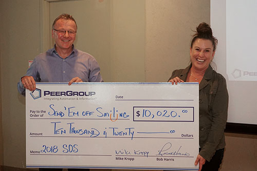 Photo of cheque presentation for Send 'Em Off Smiling 2018