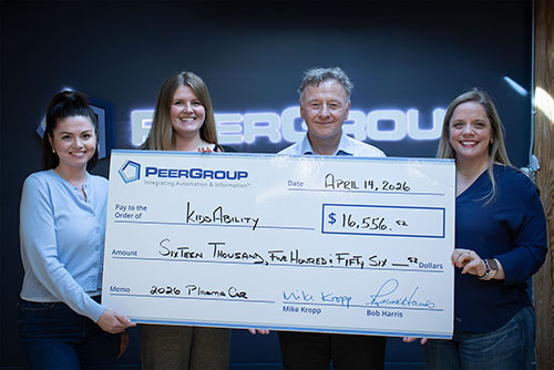 PEER Group's CEO presents donation cheque to KidsAbility